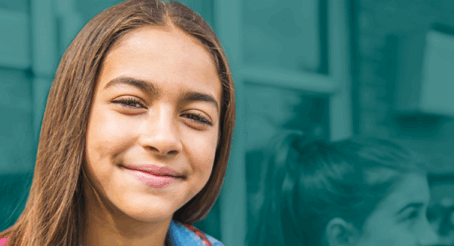 image of young female student with brown hair smiling.