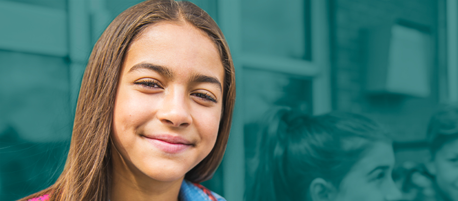 image of young female student with brown hair smiling.
